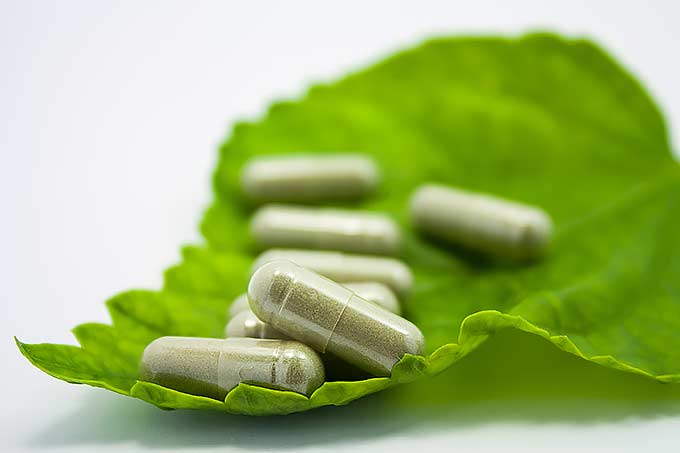 Green leaf and couple tablets