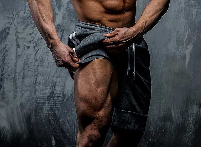 Bodybuilder showing great leg muscles