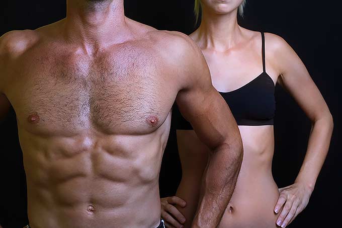 Two fitness models - a man and a girl